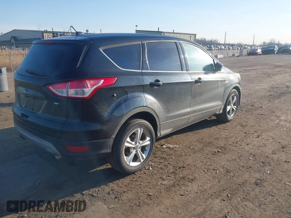 2015 Ford Escape SE with VIN 1FMCU0G79FUA40322, listed as a IAAI auction lot 41791960 with 124,543 mi miles. Bid and sale history available at carsss.com. Image 4.