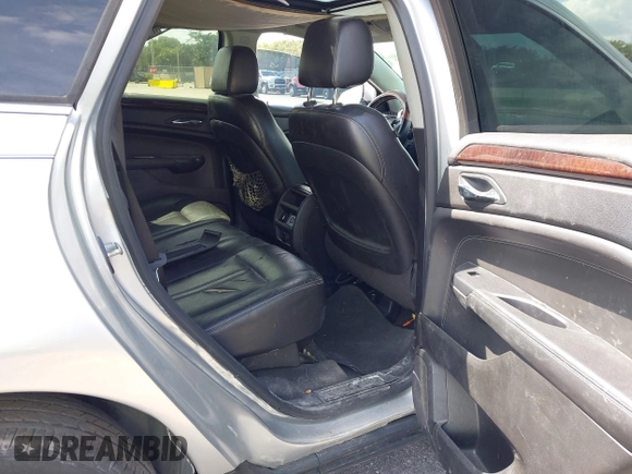 2013 Cadillac SRX Luxury Collection with VIN 3GYFNCE39DS512235, listed as a IAAI auction lot 38873243 with 133,378 mi miles and . Bid and sale history available at DreamBid. Image 8.