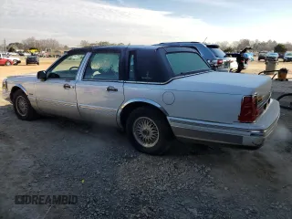 1997 Lincoln Town Car Signature z VIN 1LNLM82W9VY633666, wystawiony jako Copart lot #45396215 z przebiegiem 100 182 mil mil oraz Szkoda całkowita • Salvage title. Historia ofert i sprzedaży dostępna na DreamBid. Obrazek 2.