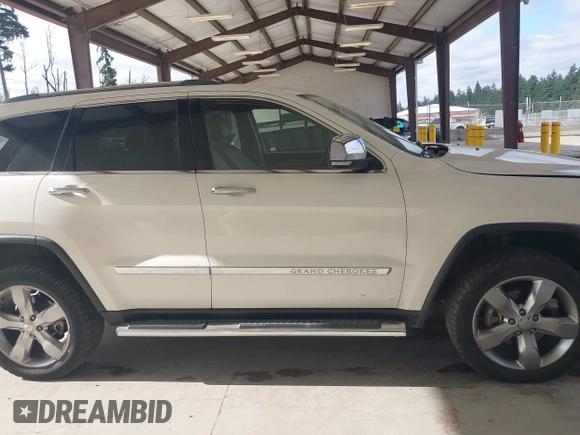 2011 Jeep Grand Cherokee Overland with VIN 1J4RR6GG0BC683624, listed as a IAAI auction lot 42729697 with 212,739 mi miles and . Bid and sale history available at DreamBid. Image 13.