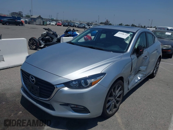 2018 Mazda 3 Touring z VIN 3MZBN1V35JM272638, wystawiony jako IAAI lot #42458722 z przebiegiem 98 393 mil mil oraz . Historia ofert i sprzedaży dostępna na DreamBid. Obrazek 17.