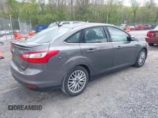 2013 Ford Focus Titanium with VIN 1FADP3J28DL225887, listed as a IAAI auction lot 42122968 with 139,248 mi miles and . Bid and sale history available at carsss.com. Image 4.