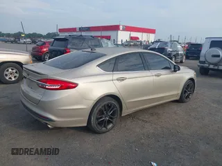 2018 Ford Fusion SE z VIN 3FA6P0HD6JR279927, wystawiony jako IAAI lot #42430172 z przebiegiem 145 080 mil mil oraz . Historia ofert i sprzedaży dostępna na DreamBid. Obrazek 4.
