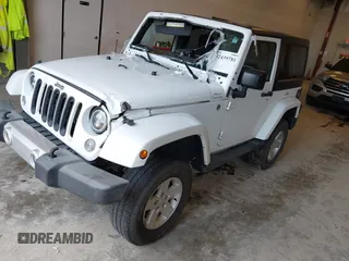2015 Jeep Wrangler Sahara with VIN 1C4AJWBG7FL648621, listed as a IAAI auction lot 42439781 with 107,148 mi miles and . Bid and sale history available at DreamBid. Image 2.