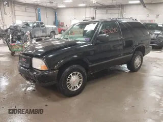 1999 GMC Jimmy SLS Comfort/Convenience with VIN 1GKCT18W1XK503719, listed as a IAAI auction lot 41536310 with 151,211 mi miles. Bid and sale history available at carsss.com. Image 17.