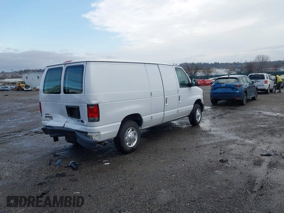 2013 Ford Econoline Cargo Commercial with VIN 1FTNE1EW2DDB11061, listed as a IAAI auction lot 41808318 with 230,677 mi miles. Bid and sale history available at carsss.com. Image 4.