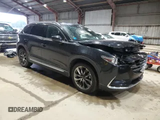 2016 Mazda CX-9 Grand Touring with VIN JM3TCADY2G0104050, listed as a Copart auction lot 56581425 with 100,737 mi miles and Salvage title. Bid and sale history available at DreamBid. Image 4.