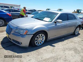 2014 Chrysler 300 with VIN 2C3CCAAG8EH264595, listed as a IAAI auction lot 42076996 with 101,659 mi miles and . Bid and sale history available at DreamBid. Image 2.