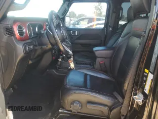 2020 Jeep Wrangler Unlimited Rubicon с VIN 1C4HJXFN3LW350249, выставлен на аукционе Copart как лот 60696895 с пробегом 56 577 миль миль и Списание • Salvage title. История ставок и продаж доступна на DreamBid. Изображение 7.