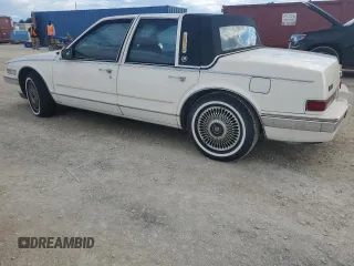 1987 Cadillac Seville z VIN 1G6KS518XHU812739, wystawiony jako Copart lot #79308574 z przebiegiem Nie podano mil oraz Szkoda całkowita • Salvage title. Historia ofert i sprzedaży dostępna na DreamBid. Obrazek 2.