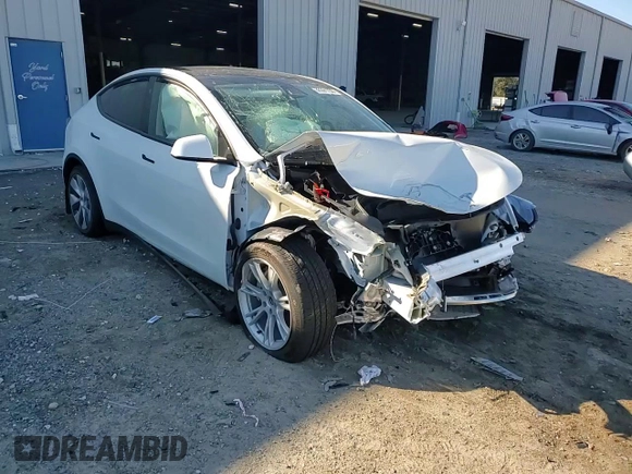 2023 Tesla Model Y Long Range z VIN 7SAYGAEE1PF810888, wystawiony jako Copart lot #88991735 z przebiegiem Nie podano mil oraz Nie do naprawy • Non repairable. Historia ofert i sprzedaży dostępna na DreamBid. Obrazek 11.