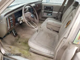 1992 Cadillac Brougham z VIN 1G6DW5479NR710170, wystawiony jako Copart lot #70194164 z przebiegiem Nie podano mil oraz Nie do naprawy. Historia ofert i sprzedaży dostępna na DreamBid. Obrazek 7.