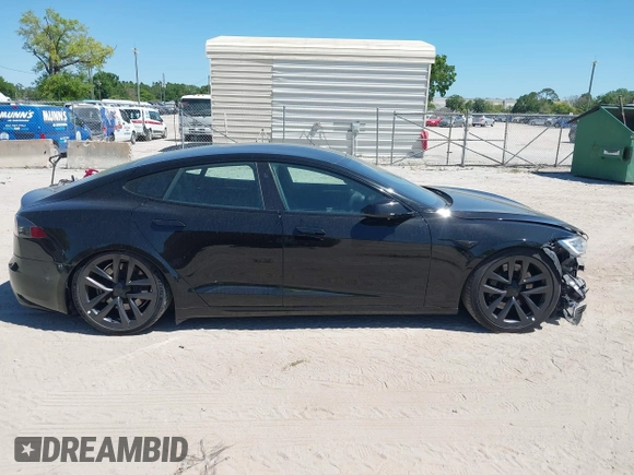 2021 Tesla Model S Plaid with VIN 5YJSA1E66MF452258, listed as a IAAI auction lot 41832000 with 42,845 mi miles and . Bid and sale history available at DreamBid. Image 14.
