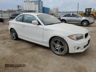 2012 BMW 1 Series 128i with VIN WBAUP7C55CVM54987, listed as a Copart auction lot 76133874 with 124,958 mi miles and Salvage title. Bid and sale history available at DreamBid. Image 4.