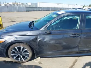 2024 Honda Civic EX z VIN 2HGFE1F76RH332735, wystawiony jako IAAI lot #42373485 z przebiegiem 13 946 mil mil oraz . Historia ofert i sprzedaży dostępna na DreamBid. Obrazek 14.