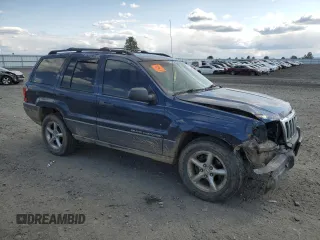 2000 Jeep Grand Cherokee Laredo z VIN 1J4GW48S2YC154627, wystawiony jako Copart lot #54173315 z przebiegiem 251 666 mil mil oraz Szkoda całkowita • Salvage title. Historia ofert i sprzedaży dostępna na DreamBid. Obrazek 4.