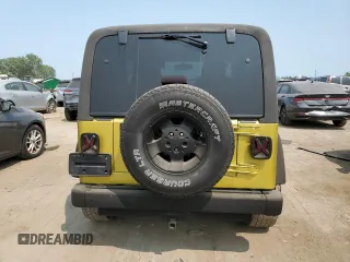 2003 Jeep Wrangler Sahara with VIN 1J4FA59S03P313418, listed as a Copart auction lot 64883094 with 184,658 mi miles and Salvage title. Bid and sale history available at DreamBid. Image 6.