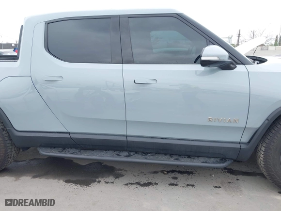 2023 Rivian R1T Launch Edition with VIN 7FCTGAAL3PN017339, listed as a IAAI auction lot 42041423 with 15,098 mi miles. Bid and sale history available at carsss.com. Image 14.