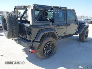 2019 Jeep Wrangler Unlimited Sahara with VIN 1C4HJXEG5KW518202, listed as a IAAI auction lot 41762229 with 91,995 mi miles and . Bid and sale history available at DreamBid. Image 4.