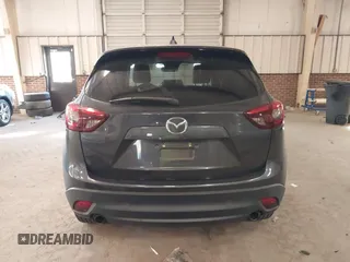 2016 Mazda CX-5 Grand Touring with VIN JM3KE2DYXG0846787, listed as a IAAI auction lot 41346364 with 113,553 mi miles. Bid and sale history available at carsss.com. Image 16.