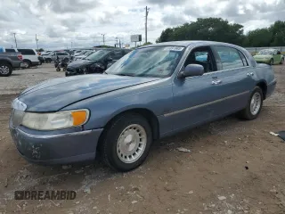 1999 Lincoln Town Car Executive with VIN 1LNHM81W2XY708010, listed as a Copart auction lot 58091965 with Not provided miles and Salvage title. Bid and sale history available at DreamBid. Image 1.