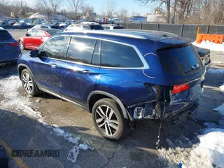 2017 Honda Pilot Touring with VIN 5FNYF6H99HB105446, listed as a IAAI auction lot 41283368 with 91,452 mi miles and . Bid and sale history available at DreamBid. Image 3.