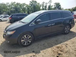 2014 Honda Odyssey Touring with VIN 5FNRL5H91EB015162, listed as a Copart auction lot 60643135 with 176,898 mi miles and Salvage title. Bid and sale history available at DreamBid. Image 1.