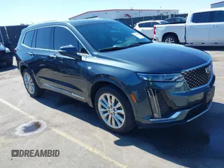2021 Cadillac XT6 Premium Luxury with VIN 1GYKPERS0MZ110029, listed as a IAAI auction lot 41669104 with 58,890 mi miles and . Bid and sale history available at carsss.com. Image 1.