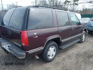 1997 Chevrolet Tahoe z VIN 1GNEK13R5VJ395365, wystawiony jako IAAI lot #42015206 z przebiegiem 121 086 mil mil oraz . Historia ofert i sprzedaży dostępna na DreamBid. Obrazek 4.