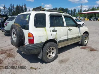 2002 Chevrolet Tracker z VIN 2CNBJ13C726919100, wystawiony jako IAAI lot #42309454 z przebiegiem Nie podano mil oraz . Historia ofert i sprzedaży dostępna na DreamBid. Obrazek 4.