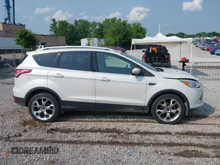 2015 Ford Escape Titanium with VIN 1FMCU0JXXFUA07175, listed as a IAAI auction lot 42447067 with 94,893 mi miles and . Bid and sale history available at DreamBid. Image 13.