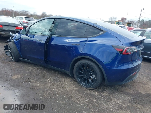 2023 Tesla Model Y Long Range with VIN 7SAYGDEE4PF891709, listed as a IAAI auction lot 41944893 with 15,864 mi miles. Bid and sale history available at carsss.com. Image 3.
