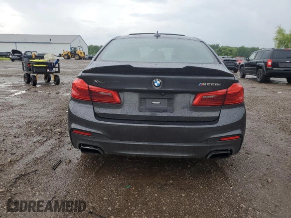 2020 BMW 5 Series M550i xDrive with VIN WBAJS7C06LCD12779, listed as a Copart auction lot 61136215 with 81,286 mi miles and Salvage title. Bid and sale history available at DreamBid. Image 6.