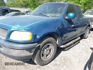 2000 Ford F-150 XL with VIN 1FTRX17L5YNC02971, listed as a IAAI auction lot 42041309 with Not provided miles and . Bid and sale history available at DreamBid. Image 2.