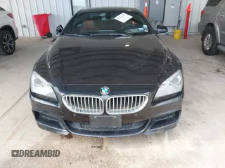 2012 BMW 6 Series 650i z VIN WBALX3C51CDV77602, wystawiony jako IAAI lot #41668235 z przebiegiem 103 684 mil mil oraz . Historia ofert i sprzedaży dostępna na DreamBid. Obrazek 6.