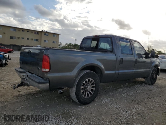 2002 Ford F-250 XL with VIN 1FTNW20F12EB93947, listed as a Copart auction lot 77836054 with 322,030 mi miles and Salvage Title. Bid and sale history available at DreamBid. Image 3.