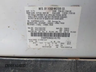 2014 Ford Taurus SEL with VIN 1FAHP2E84EG141795, listed as a IAAI auction lot 42133668 with 154,009 mi miles and . Bid and sale history available at DreamBid. Image 9.