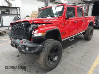 2022 Jeep Gladiator Altitude z VIN 1C6HJTAGXNL117353, wystawiony jako IAAI lot #42427921 z przebiegiem 28 801 mil mil oraz . Historia ofert i sprzedaży dostępna na DreamBid. Obrazek 2.