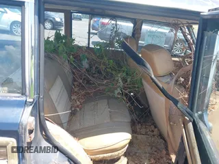 1988 Jeep Grand Wagoneer with VIN 1JCNJ15U7JT237152, listed as a IAAI auction lot 42682009 with 159,950 mi miles and . Bid and sale history available at DreamBid. Image 8.