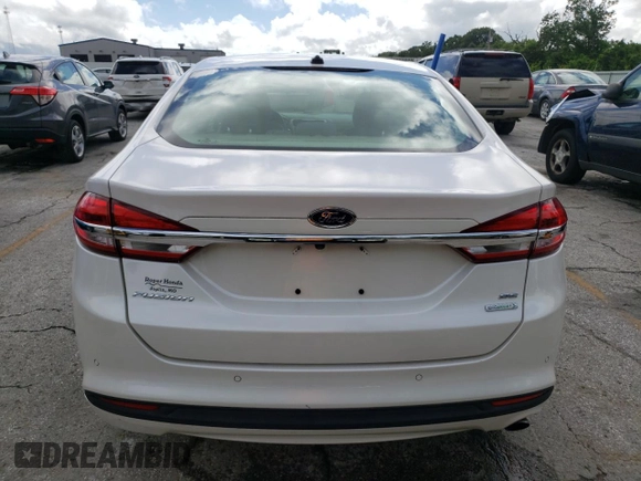 2018 Ford Fusion SE z VIN 3FA6P0HD9JR183760, wystawiony jako Copart lot #59983025 z przebiegiem 95 206 mil mil oraz Szkoda całkowita • Salvage title. Historia ofert i sprzedaży dostępna na DreamBid. Obrazek 6.