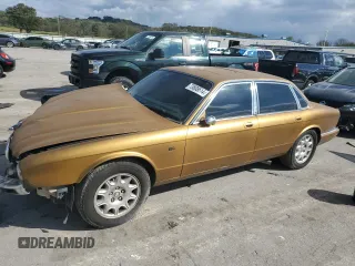 2001 Jaguar XJ with VIN SAJDA14C81LF27992, listed as a Copart auction lot 73808614 with 71,749 mi miles and Salvage Title. Bid and sale history available at carsss.com. Image 1.