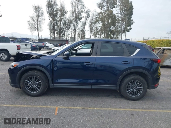 2019 Mazda CX-5 Touring with VIN JM3KFACM5K0697137, listed as a IAAI auction lot 41720253 with 50,416 mi miles. Bid and sale history available at carsss.com. Image 14.