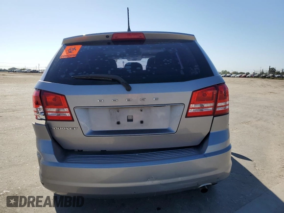 2015 Dodge Journey American Value with VIN 3C4PDCABXFT712192, listed as a Copart auction lot 55680975 with 104,579 mi miles and Salvage Title. Bid and sale history available at DreamBid. Image 6.