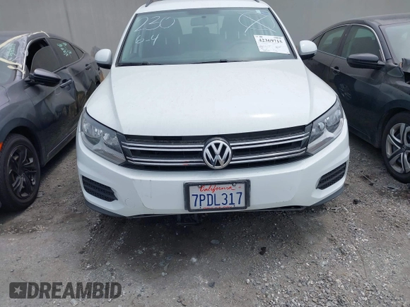 2015 Volkswagen Tiguan S z VIN WVGAV7AX7FW564563, wystawiony jako IAAI lot #42369715 z przebiegiem 27 976 mil mil oraz . Historia ofert i sprzedaży dostępna na DreamBid. Obrazek 13.