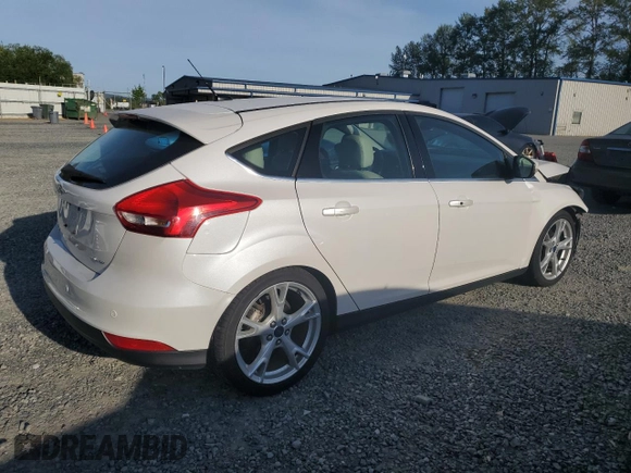 2015 Ford Focus Titanium z VIN 1FADP3N24FL262321, wystawiony jako Copart lot #59635525 z przebiegiem Nie podano mil oraz Szkoda całkowita • Salvage title. Historia ofert i sprzedaży dostępna na DreamBid. Obrazek 3.