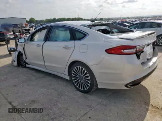 2018 Ford Fusion Titanium с VIN 3FA6P0K94JR275623, выставлен на аукционе Copart как лот 59639215 с пробегом 84 919 миль миль и Списание • Salvage title. История ставок и продаж доступна на DreamBid. Изображение 2.