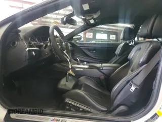 2014 BMW M6 z VIN WBSLX9C58ED160480, wystawiony jako Copart lot #64464985 z przebiegiem 58 514 mil mil oraz Czysty tytuł • Clean title. Historia ofert i sprzedaży dostępna na DreamBid. Obrazek 7.