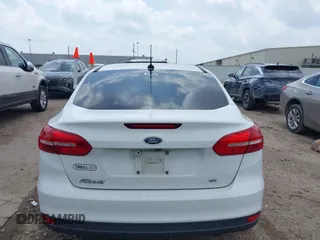 2018 Ford Focus SE z VIN 1FADP3F22JL292697, wystawiony jako IAAI lot #42094271 z przebiegiem 43 614 mil mil oraz . Historia ofert i sprzedaży dostępna na DreamBid. Obrazek 16.