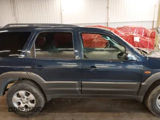 2003 Mazda Tribute LX with VIN 4F2YZ94193KM56345, listed as a IAAI auction lot 41200769 with 141,728 mi miles and . Bid and sale history available at DreamBid. Image 13.