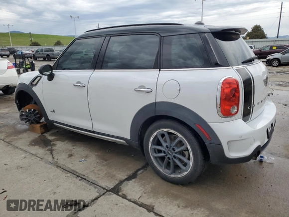 2015 MINI Countryman S with VIN WMWZC5C58FWP46931, listed as a Copart auction lot 59183495 with 105,731 mi miles and Salvage title. Bid and sale history available at DreamBid. Image 2.